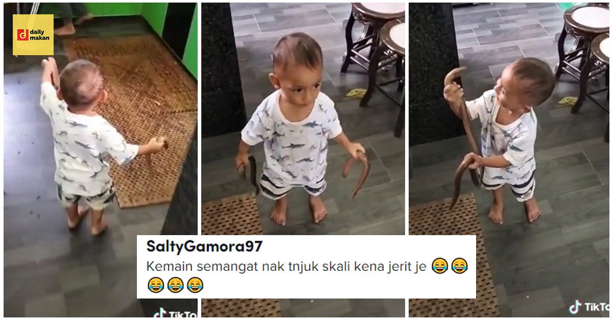 adik lelaki selamba pegang belut